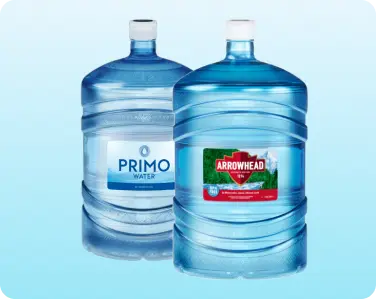 Assortment of 5-gallon bottled water jugs ready for delivery.