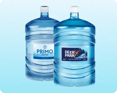 Assortment of 5-gallon bottled water jugs ready for delivery.