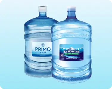 Assortment of 5-gallon bottled water jugs ready for delivery.