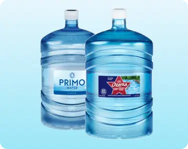 Assortment of 5-gallon bottled water jugs ready for delivery.