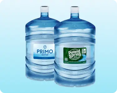Assortment of 5-gallon bottled water jugs ready for delivery.